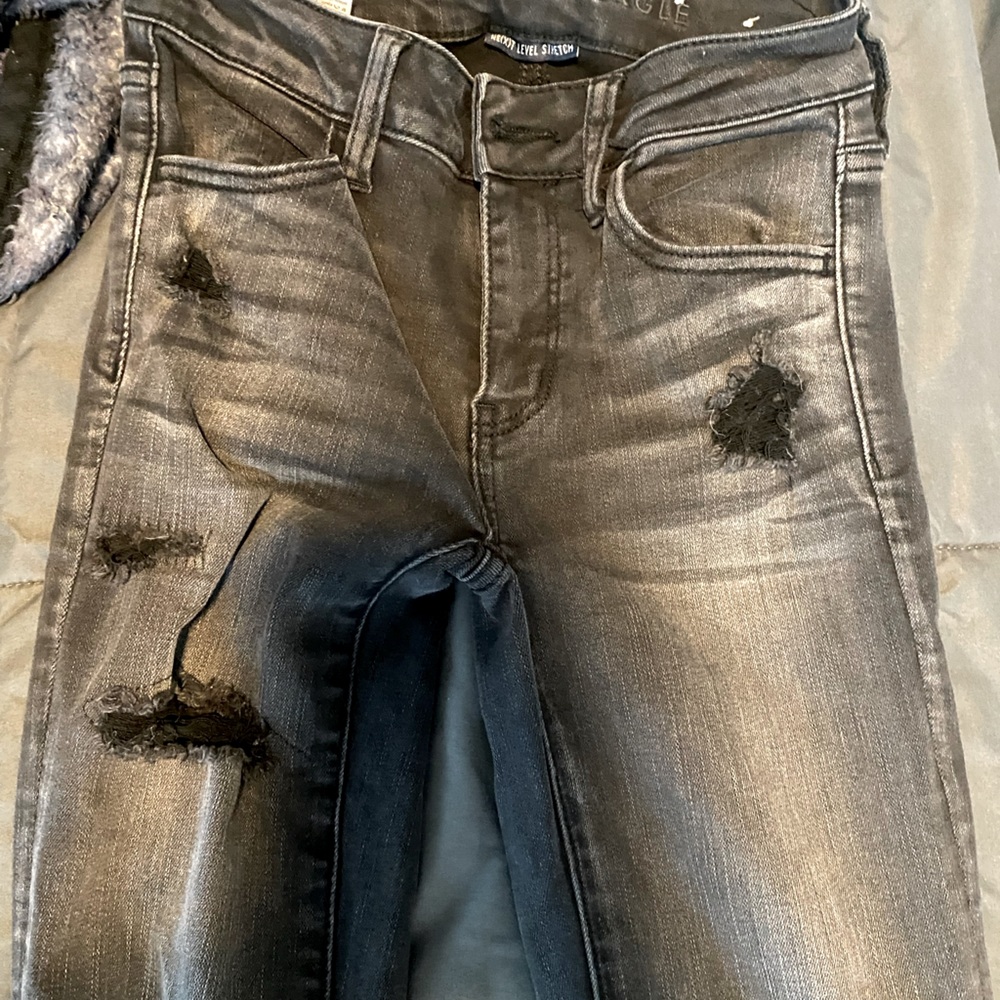 Destroyed AE black skinny jeans. Worn a few times! Size 0